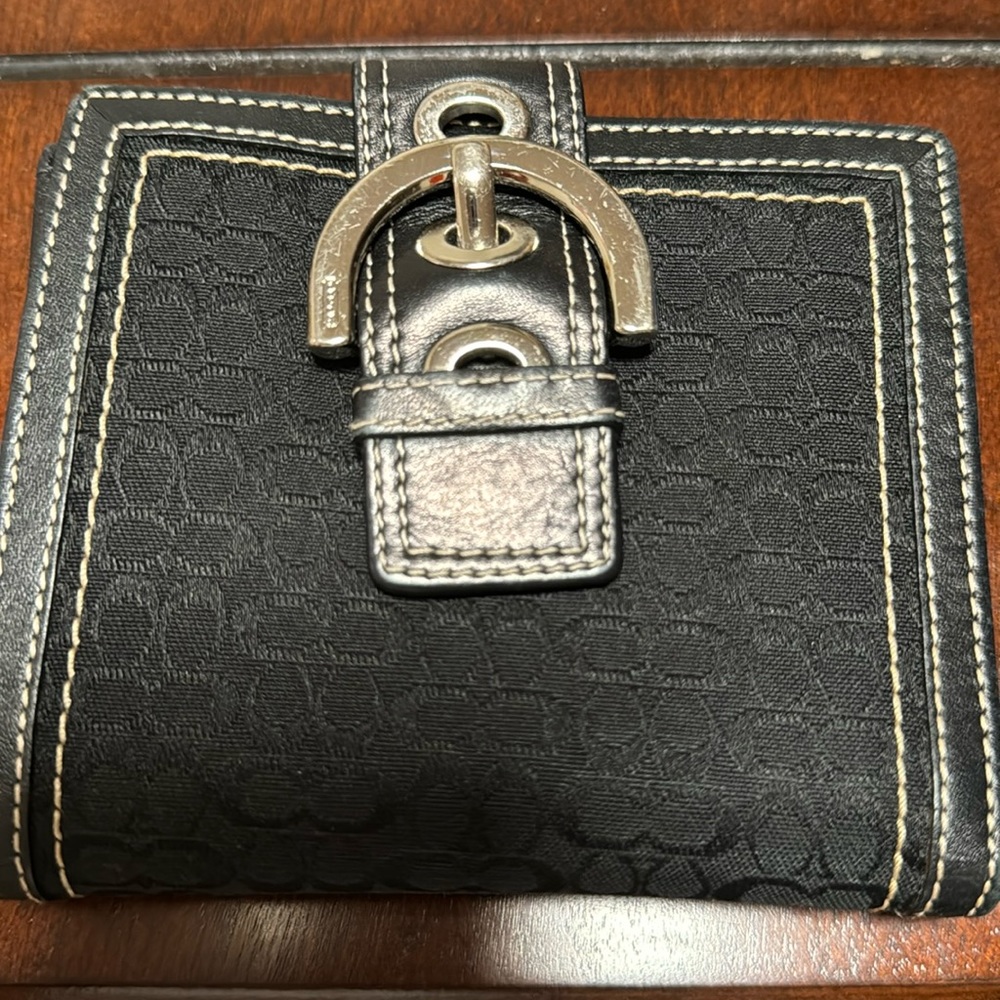 Coach Medium Wallet in Black Signature Canvas.